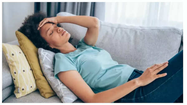Stressed woman holding her stomach