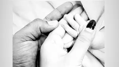 Mukesh Kumar and his wife celebrate the birth of their son