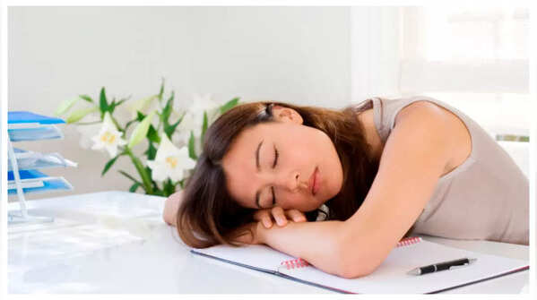 An individual feeling dizzy, a potential sign of cardiac distress