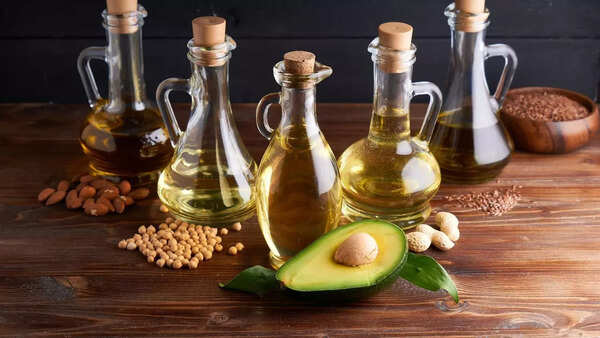 Different types of hair oils on a shelf