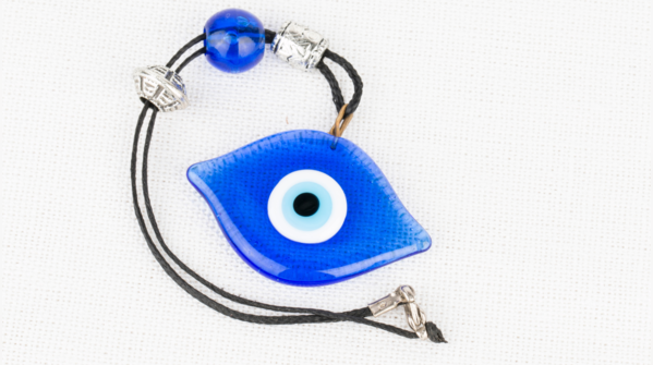 A broken Evil Eye amulet, symbolizing protection successfully delivered.