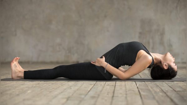 A woman performing the Matsyasana, or Fish Pose.