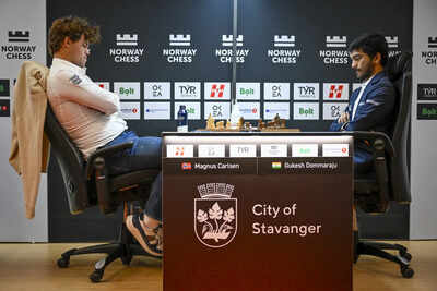 Magnus Carlsen and D. Gukesh during a match.