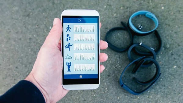 Close-up of a stressed person looking at a fitness tracker