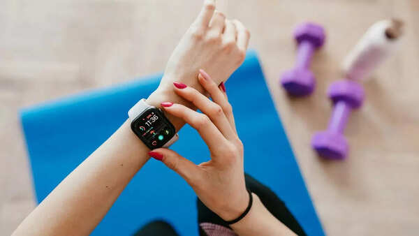Person using a fitness tracker during a workout